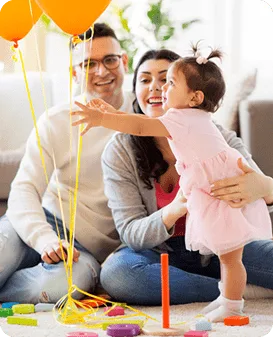 Parents playing with their toddler at home